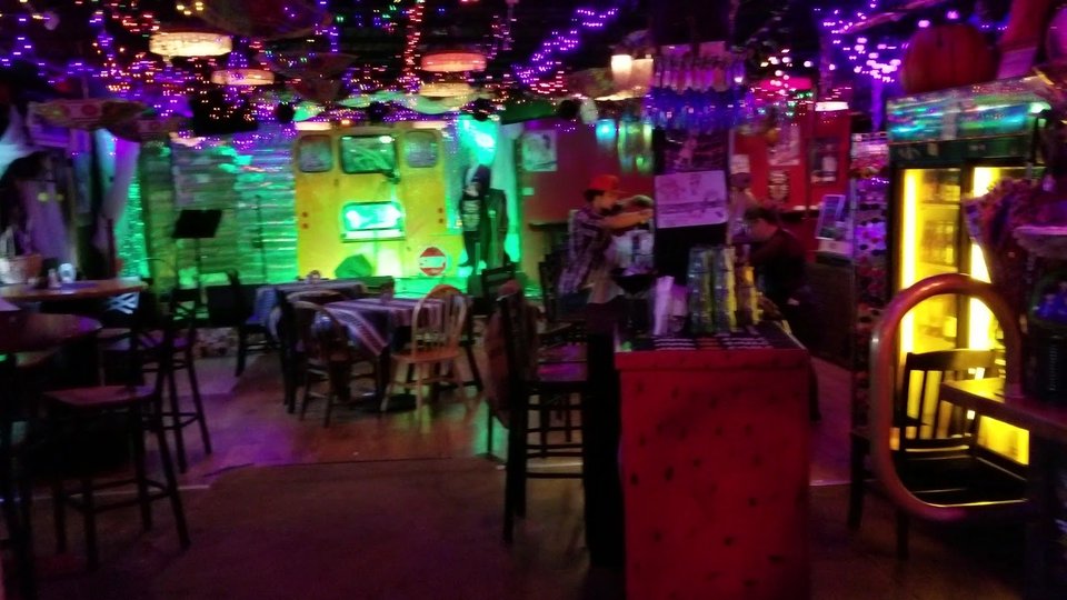 Spacious pub dining area with eclectic decor.